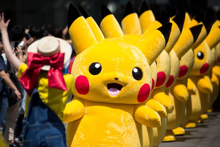 YOKOHAMA, JAPAN - AUGUST 09:  Performers dressed as Pikachu, a character from Pokemon series game titles, march during the Pikachu Outbreak event hosted by The Pokemon Co. on August 9, 2017 in Yokohama, Kanagawa, Japan. A total of 1, 500 Pikachus appear at the city's landmarks in the Minato Mirai area aiming to attract visitors and tourists to the city. The event will be held through until August 15.  (Photo by Tomohiro Ohsumi/Getty Images)