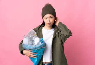 chinese-girl-holding-bag-full-plastic-bottles-recycle-isolated_1368-173916.jpg