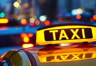 yellow-taxi-sign-on-cab-car-at-139827239-8d9-min.jpg